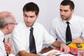 Three businessman sitting at table during meeting Royalty Free Stock Photo