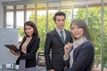 Three businessmen in the meeting room. Team of Asian business posing in meeting room at office. Working brainstorming at spacious Royalty Free Stock Photo