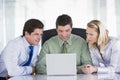 Three businesspeople in a boardroom