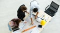 Three businesspeople, female secretary, a boss in formal suit and male engineer standing together in office and discussing Royalty Free Stock Photo