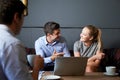 Three Businesspeople Having Meeting In Cafe Royalty Free Stock Photo