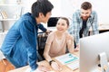 Three businesspeople working in office together Royalty Free Stock Photo