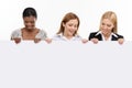 Three businesswoman holding white board Royalty Free Stock Photo