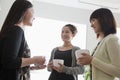Three businesswomen on the coffee break in the office Royalty Free Stock Photo