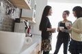 Three businesswomen on the coffee break in the office Royalty Free Stock Photo