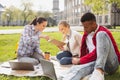 Three busy undergraduates preparing their home assignment Royalty Free Stock Photo