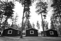 Three cabins in woods Royalty Free Stock Photo