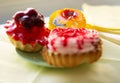 three cakes with strawberries, slices of kiwi cherry and strawberry jam Royalty Free Stock Photo