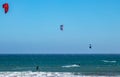 Three California wind surfers inline catching waves Royalty Free Stock Photo