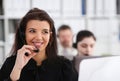 Three call centre service operators at work Royalty Free Stock Photo