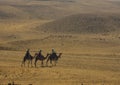 Three camel riders at the Giza Necropolis, Egypt