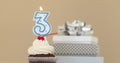 Three 3 candle in cupcake pastel background