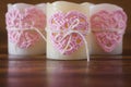 Three candles with handmade crochet pink heart for Saint Valenti Royalty Free Stock Photo