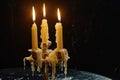 Three candles sitting on top of a table. Versatile image suitable for various themes and occasions Royalty Free Stock Photo