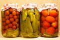 Three Canned Fresh Vegetables On Background