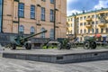 Three cannons and howitzers from the World War II are on the street near the Historical Museum