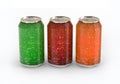 Three cans of colored carbonated drinks.