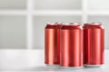 Three Red Beverage Cans on a White Background Royalty Free Stock Photo
