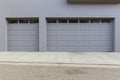 Three car garage door on slop Royalty Free Stock Photo