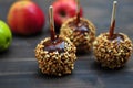 Three caramel apples with peanuts Royalty Free Stock Photo