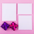 Three cards and gift boxes on pink background