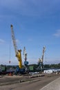 Three cargo cranes at the port Royalty Free Stock Photo
