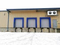 Three cargo gates for loading and unloading vans of trucks. Royalty Free Stock Photo