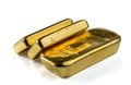 Three cast gold bars, the typical form of bullion gold bullion. Royalty Free Stock Photo