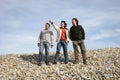 Three casual young men at the beach