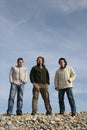 Three casual young men at the beach