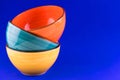 Three Ceramic Bright Multicolored Bowls Blue Background Copy Space Royalty Free Stock Photo