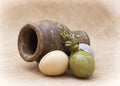 Three ceramic easter eggs and clay vase Royalty Free Stock Photo