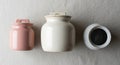 A matching lid the middle jar is larger and white with a ceramic Royalty Free Stock Photo