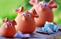 Three ceramic piggy banks