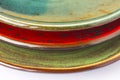 Three ceramic plates of different colors. Part of the frame Royalty Free Stock Photo