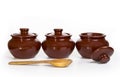 Three ceramic pots for oven isolated on white background Royalty Free Stock Photo