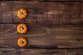 Three ceramic pumpkin on woden table. Halloween, harvest