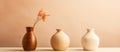 Three ceramic vases filled with flowers adorn the tabletop Royalty Free Stock Photo