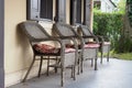 The three chairs are all in a line on the front porch. Royalty Free Stock Photo