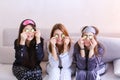 Three charming female friends relax and make facial beauty treat Royalty Free Stock Photo
