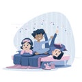 Three cheerful kids of diverse race in blue nightwear lie on the bed, having pajama party. Sleepover and slumber party. Royalty Free Stock Photo