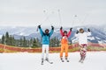 Friends skiers having fun at ski resort in the mountains in winter, skiing and snowboarding Royalty Free Stock Photo