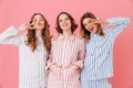 Three cheerful women 20s wearing leisure clothings having fun at Royalty Free Stock Photo