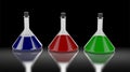 Three chemistry tubes with different colors of liquid.