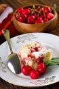 Three cherries in front of pie on white plate Royalty Free Stock Photo