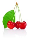 Three Cherry with stem and a leaf isolated on white Royalty Free Stock Photo