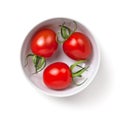 Three Cherry Tomatoes In White Bowl Isolated