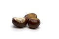 Three chestnuts on a background