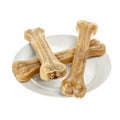 Dog food bones on plate Royalty Free Stock Photo