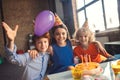 Three children celebrating bday and feeling happy